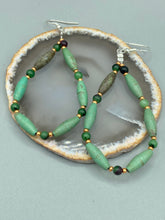Load image into Gallery viewer, These stylish fish hook style earrings feature intricate beadwork crafted with forest green magnesite and ruby zoisite stones. Measurements: 2 3/4&quot; length
