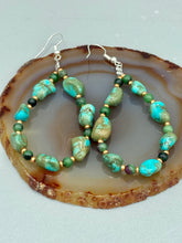 Load image into Gallery viewer, These earrings feature blue-green magnesite and ruby zoisite stones set in gold glass beaded hoops. Measurements: 2 1/2&quot; length 
