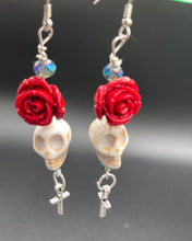 Load image into Gallery viewer, Frida Kahlo Inspired Earrings, Chicana Chingona Chola Style Jewelry. Howlite Skull Bead With Red Quartize Rose Beads. Beautifully and elegant set of earrings captures Frida Kahlo&#39;s signature floral crown on her head, dangling silver plated cross gives these earrings some movement. These are a beautiful piece of jewelry to wear for inspiration or a great Dia De Los Muertos jewelry piece. You can dress these up or down, it will definitely give your outfit a unique look. 2 ” in length
