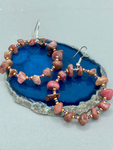 Load image into Gallery viewer, These Rhodonite Stone Chip Beaded Hoop Earrings feature natural rhodonite stones and light purple and gold glass beads for a shabby chic, boho chic, and nature-inspired bohemian look. Measurements: 1&quot; length
