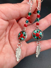 Load image into Gallery viewer, These Southwester Style Silver Feather Light Dainty Beaded Earrings are richly adorned with turquoise, bright red and dark green, and feature silver plated feather charms for a fun, dynamic effect. A perfect match for any Chingona Carbrona, La India Princess, Fierce Goddess Warrior, or Tribal Pattern look.  Measurements: 3” in length
