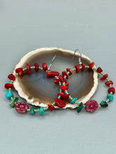 Load image into Gallery viewer, These Bamboo Coral Red Stone Chip earrings are complemented by turquoise and gold glass beading and a shimmery red pressed glass flower charm. The charm's iridescent shimmer finish has subtle hues of gold, purple, blue and pink.  Measurements: 2" length
