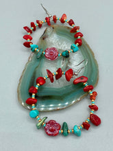 Load image into Gallery viewer, These Bamboo Coral Red Stone Chip earrings are complemented by turquoise and gold glass beading and a shimmery red pressed glass flower charm. The charm&#39;s iridescent shimmer finish has subtle hues of gold, purple, blue and pink.  Measurements: 2&quot; length
