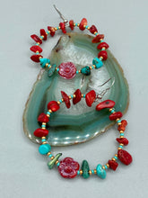 Load image into Gallery viewer, These Bamboo Coral Red Stone Chip earrings are complemented by turquoise and gold glass beading and a shimmery red pressed glass flower charm. The charm's iridescent shimmer finish has subtle hues of gold, purple, blue and pink.  Measurements: 2" length
