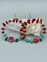 Load image into Gallery viewer, These Bamboo Coral Red Stone Chip earrings are complemented by turquoise and gold glass beading and a shimmery red pressed glass flower charm. The charm&#39;s iridescent shimmer finish has subtle hues of gold, purple, blue and pink.  Measurements: 2&quot; length
