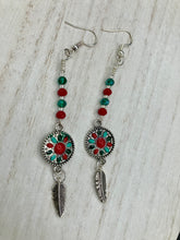 Load image into Gallery viewer, These Southwester Style Silver Feather Light Dainty Beaded Earrings are richly adorned with turquoise, bright red and dark green, and feature silver plated feather charms for a fun, dynamic effect. A perfect match for any Chingona Carbrona, La India Princess, Fierce Goddess Warrior, or Tribal Pattern look.  Measurements: 3” in length
