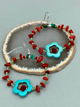 Load image into Gallery viewer, These earrings feature a turquoise magnesite floral bead with a dark red glass bead in the center and artfully beaded with bamboo red coral and turquoise stones. Measurements: 1 3/4" length
