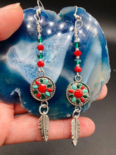 Load image into Gallery viewer, These Southwester Style Silver Feather Light Dainty Beaded Earrings are richly adorned with turquoise, bright red and dark green, and feature silver plated feather charms for a fun, dynamic effect. A perfect match for any Chingona Carbrona, La India Princess, Fierce Goddess Warrior, or Tribal Pattern look.  Measurements: 3” in length
