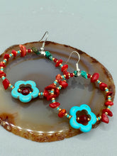 Load image into Gallery viewer, These earrings feature a turquoise magnesite floral bead with a dark red glass bead in the center and artfully beaded with bamboo red coral and turquoise stones. Measurements: 1 3/4" length
