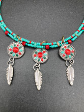 Load image into Gallery viewer, This two-stranded necklace features a vibrant Southwest-inspired design. Hand-beaded turquoise, bright red, and dark green colors, along with silver-plated feather charms, add dynamic movement to the piece. An ideal set for chingona guerrera carbonas, la India princesses, warrior cosplay, and other native-inspired looks.  Measurements:  Necklace is 15” adjustable up to 18" in length
