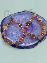 Load image into Gallery viewer, These pure rhodonite stone chip earrings with lustrous fuchsia and gold glass beading boast shimmering accents of blue, gold, and purple. Measurements: 2 1/4&quot; length
