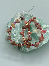 Load image into Gallery viewer, These pure rhodonite stone chip earrings with lustrous fuchsia and gold glass beading boast shimmering accents of blue, gold, and purple. Measurements: 2 1/4&quot; length
