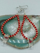 Load image into Gallery viewer, This pair of earrings contains intricately detailed koi-shaped glass beads, beaded along with dark red and gold glass beads. The koi fish beads feature fins and an eye, adding a visual element of realism to the piece. Perfect for creating a Hippie Vibe, Boho Chic, Nature Inspired, and Bohemian style.  Measurements: 2” in length   
