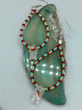 Load image into Gallery viewer, This piece of jewelry features Koi fish glass beads accented with teal, red, and gold glass beads. The fish have intricate details, including fins and eyes, creating a vibrant, colorful look. Measurements: 2 3/4” in length   
