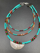 Load image into Gallery viewer, Three strands of Southwestern Style Inspired Adjustable Choker Beaded Necklace features an eye-catching blend of vibrant turquoise, red, green, gold, and yellow glass beads, accented with a wide silver plated tribal pattern pendant.  Measurements:  Necklace is 15 1/2” adjustable up to 18" in length
