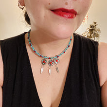 Load image into Gallery viewer, This two-stranded necklace features a vibrant Southwest-inspired design. Hand-beaded turquoise, bright red, and dark green colors, along with silver-plated feather charms, add dynamic movement to the piece. An ideal set for chingona guerrera carbonas, la India princesses, warrior cosplay, and other native-inspired looks.  Measurements:  Necklace is 15” adjustable up to 18" in length
