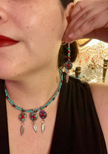 Load image into Gallery viewer, These Southwester Style Silver Feather Light Dainty Beaded Earrings are richly adorned with turquoise, bright red and dark green, and feature silver plated feather charms for a fun, dynamic effect. A perfect match for any Chingona Carbrona, La India Princess, Fierce Goddess Warrior, or Tribal Pattern look.  Measurements: 3” in length
