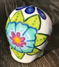 Load image into Gallery viewer, This stunning Mini Dia de Los Muertos Calavera is a one-of-a-kind hand-painted ceramic sugar skull, with an aquatic-inspired color palette. The unique flower on the back of the skull is painted to look like the head of a jellyfish. Display this beautiful piece of art and enjoy the elegance and beauty of its delicate dance.  Measurements: H 2 3/4” x W 2” x D 2”
