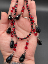 Load image into Gallery viewer, Dark Goth, Vampire Goth, Misfits - Black and Red Choker Style Glass Beaded Necklace. Large Tear Drop Black Hanging Glass Beads. Contains a mixture of shape and color glass beads to give it complexity and depth to the look. Necklace beautifully drapes down your neck. Dark, beautiful, unique gift for the bold. Necklace is 16” adjustable up to 18" - teardrop hanging beads are 2” Height Earrings: 2" in length
