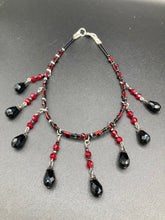 Load image into Gallery viewer, Dark Goth, Vampire Goth, Misfits - Black and Red Choker Style Glass Beaded Necklace. Large Tear Drop Black Hanging Glass Beads. Contains a mixture of shape and color glass beads to give it complexity and depth to the look. Necklace beautifully drapes down your neck. Dark, beautiful, unique gift for the bold. Necklace is 16” adjustable up to 18" - teardrop hanging beads are 2” Height Earrings: 2" in length
