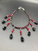 Load image into Gallery viewer, Dark Goth, Vampire Goth, Misfits - Black and Red Choker Style Glass Beaded Necklace. Large Tear Drop Black Hanging Glass Beads. Contains a mixture of shape and color glass beads to give it complexity and depth to the look. Necklace beautifully drapes down your neck. Dark, beautiful, unique gift for the bold. Necklace is 16” adjustable up to 18" - teardrop hanging beads are 2” Height Earrings: 2" in length
