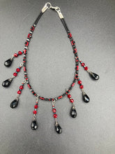 Load image into Gallery viewer, Dark Goth, Vampire Goth, Misfits - Black and Red Choker Style Glass Beaded Necklace. Large Tear Drop Black Hanging Glass Beads. Contains a mixture of shape and color glass beads to give it complexity and depth to the look. Necklace beautifully drapes down your neck. Dark, beautiful, unique gift for the bold. Necklace is 16” adjustable up to 18" - teardrop hanging beads are 2” Height Earrings: 2" in length
