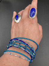 Load image into Gallery viewer, This Ocean Blue Waves Nine Stands Glass Beaded Chunky Wide Bracelet is the ideal accessory for any summer seaside look. Measurements: 8&quot; in length
