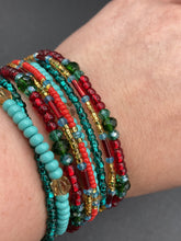 Load image into Gallery viewer, Vibrant And Enchanting Southwest Style Jewelry. This stunningly bold statement piece contains nine beaded strands full of variant turquoise, bright and dark reds and greens, golds and yellows. I created this beautiful jewelry piece by using a wide variety of different bead shapes from large and small round, round tubes, and squares.  Measurements: 7 1/2" in length
