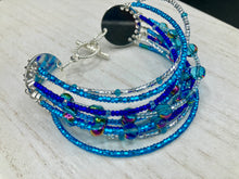 Load image into Gallery viewer, This Ocean Blue Waves Nine Stands Glass Beaded Chunky Wide Bracelet is the ideal accessory for any summer seaside look. Measurements: 8&quot; in length
