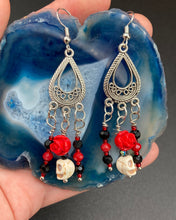 Load image into Gallery viewer, Frida Kahlo Inspired Earrings, Tiny Howlite Skull Beads With Red Quartize Rose Beads. Elegant set of earrings captures Frida Kahlo&#39;s signature floral crown on her head. Red and black shimmery glass beads to give a little pop of color and incorporated some movement. These are a beautiful piece of jewelry to wear for inspiration or a great Dia De Los Muertos jewelry piece. You can dress these up or down, it will definitely give your outfit a unique look. 2 ” in length
