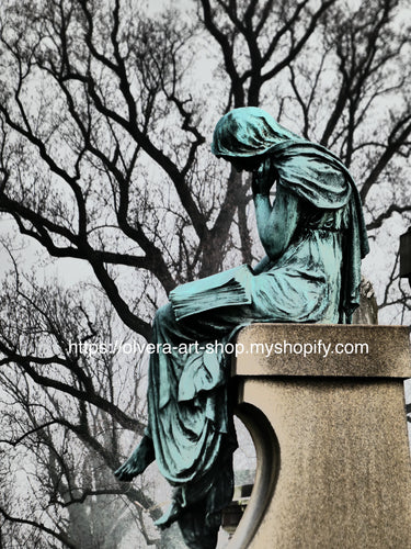 It features a beautiful, vintage-style photograph of a cemetery angel statue sitting down reading the bible, a thoughtful reminder of the power of mercy and compassion.