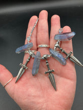 Load image into Gallery viewer, This elegant and dark necklace features shimmering light silver and gray glass beads of varying sizes and shapes for texture and dimension. The necklace is finished with blue luster crystal stone nuggets and nickel-free dagger pendants, creating a beautiful draping effect. Measurements:   Necklace is 17”adjustable up to 19&quot; 
